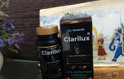 Clarilux bottle and box on a glass table next to a painting