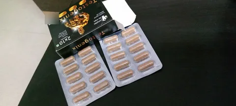 Testogenix box opened with two blister strips of capsules